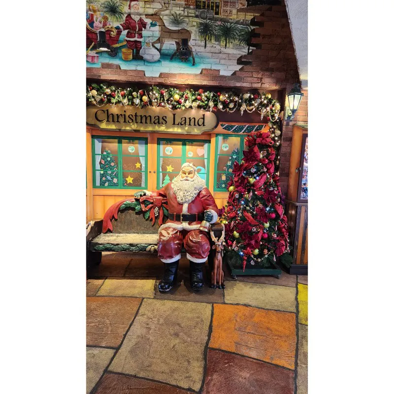 Santa Claus statue with Christmas tree inside Christmas Land at American Village in Chatan, Okinawa