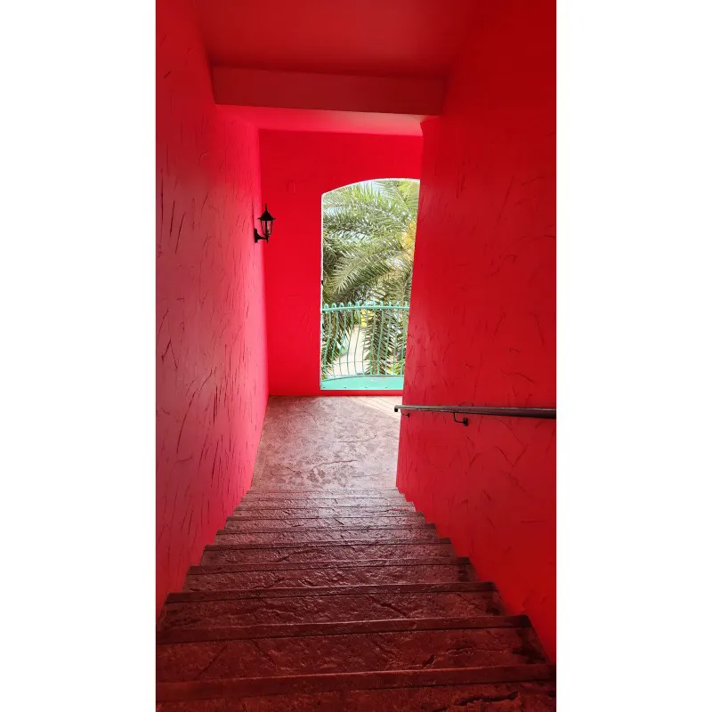 Pink-painted stairway at American Village in Chatan, Okinawa