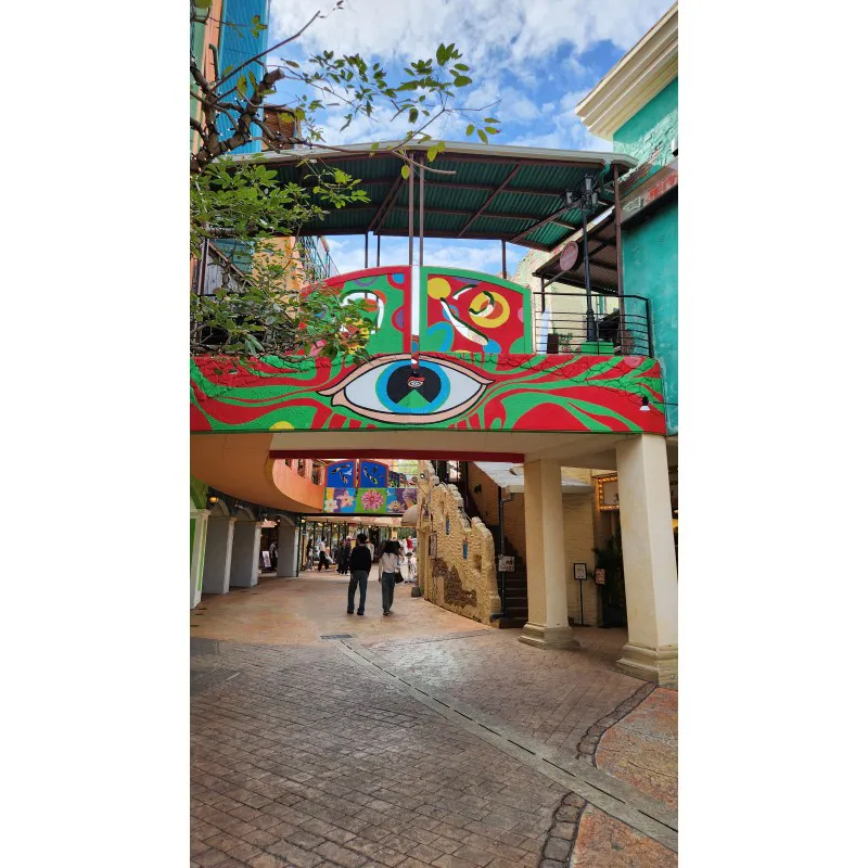 Colorful mural with a large eye on a walkway at American Village in Chatan, Okinawa