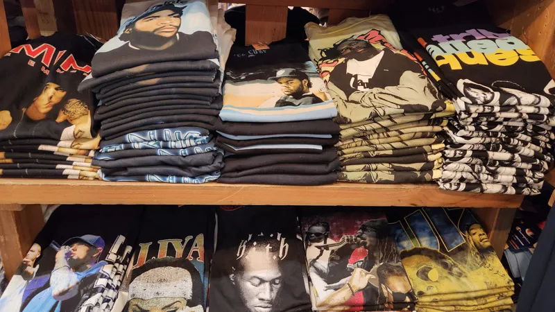 Folded rap and hip-hop T-shirts on shelves at American Village in Chatan, Okinawa