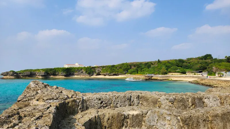 Coastal view of beach and turquoise sea at Yomitan Coral Farm