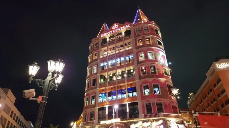 Depot Central tower illuminated at night in American Village, Chatan, Okinawa
