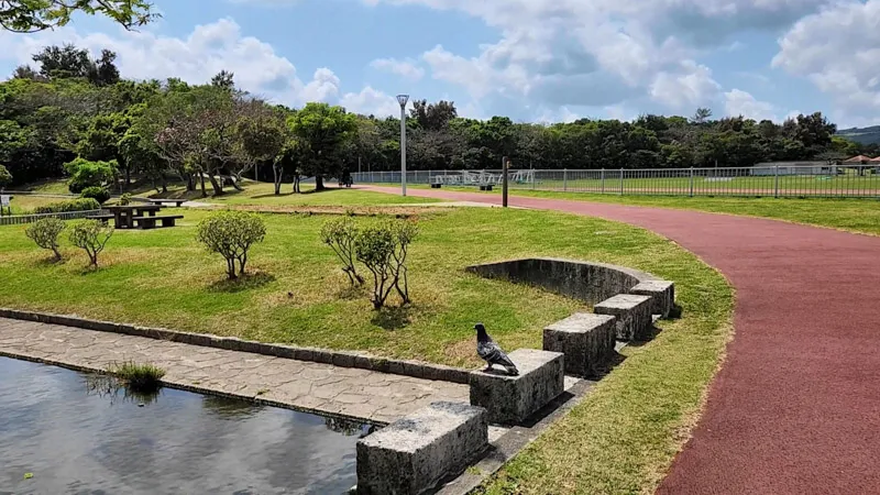 Red running track with bird at Kitanakagusuku Sports Park Okinawa