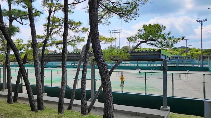 Tennis courts with players at Kitanakagusuku Sports Park Okinawa