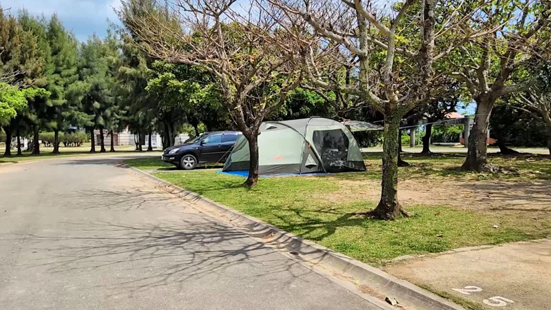 Camping area with tent set up at Kitanakagusuku Sports Park Okinawa
