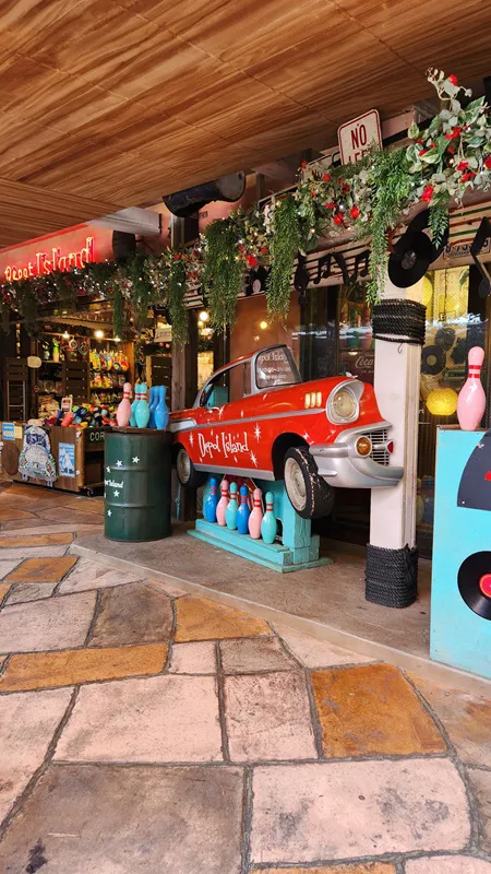 Red vintage car and bowling pins decoration at Okinawa