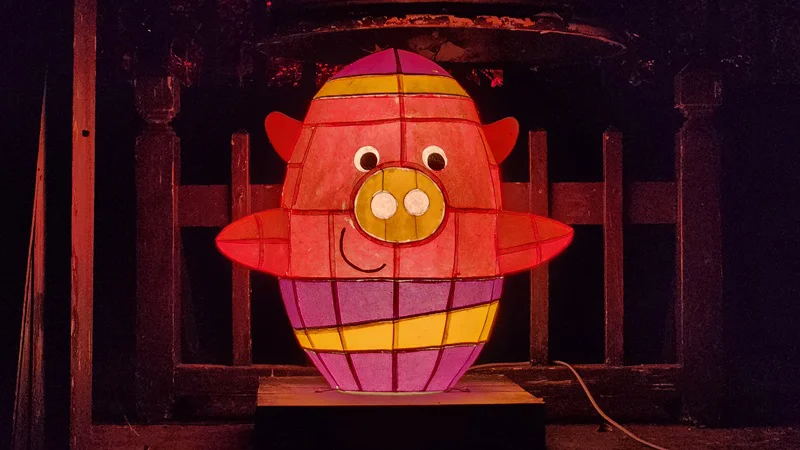 Colorful Yomiton pig shaped lantern glowing at night during the Ryukyu Yokai Festival