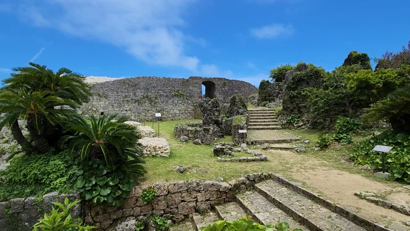 Stone stairs leading to an archway gate at Nakagusuku Castle ruins in Okinawa