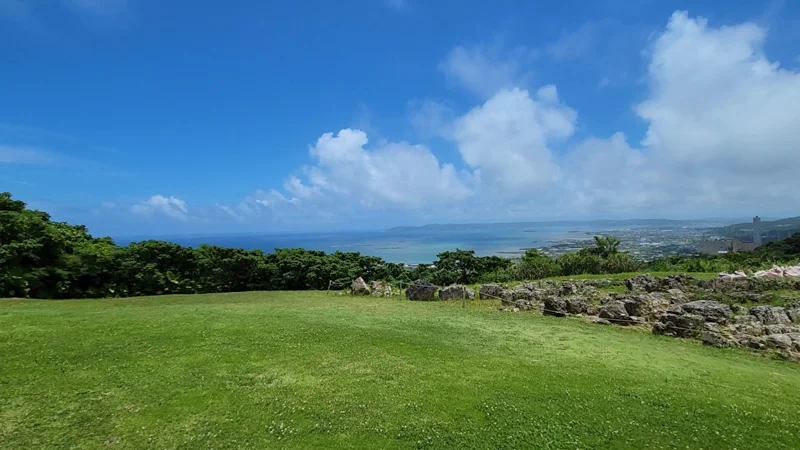 Open grassy field with view of the ocean from Nakagusuku Castle ruins