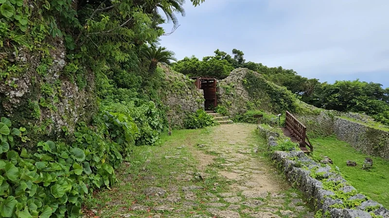 Nozura-zumi wall with wooden gate at Nakagusuku Castle ruins