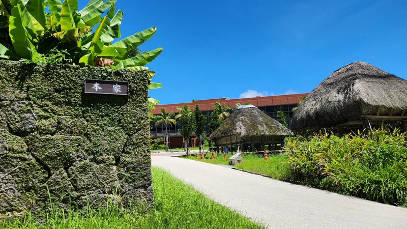 Traditional thatched storehouses at the entrance of Native Okinawa Village