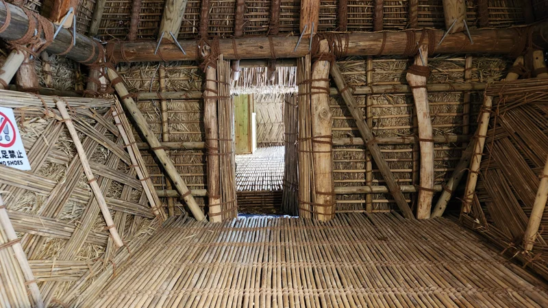 Interior of a traditional bamboo house with woven floor