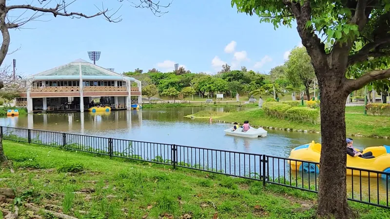 Yellow and white pedal boats on the pond at Kitanakagusuku Sports Park Okinawa