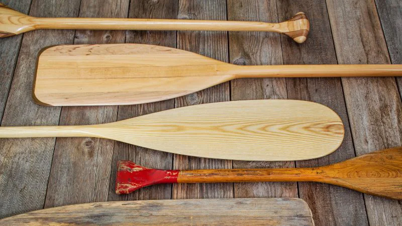 Wooden paddles on rustic background