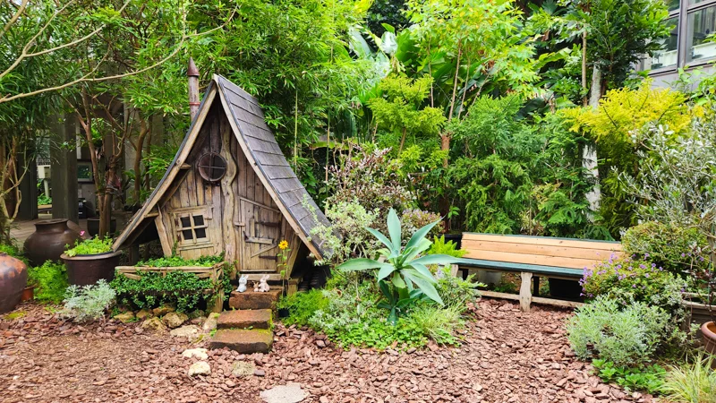 Small wooden fairy house in a tropical garden in Okinawa