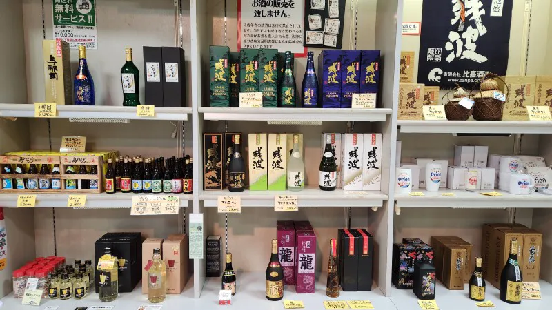 Shelves with bottles of awamori and local Okinawan liquor at a shop in Yomitan