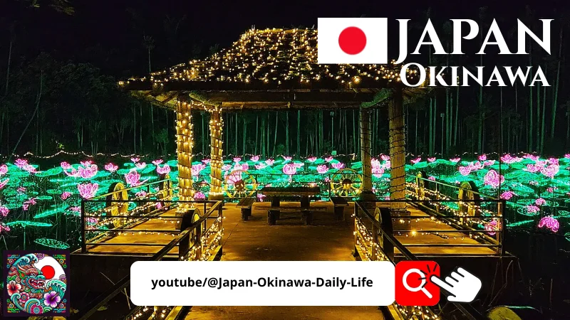 Pavilion and lotus field illuminated with colorful lights at Southeast Botanical Gardens, Okinawa, Japan, with Japan Okinawa logo.