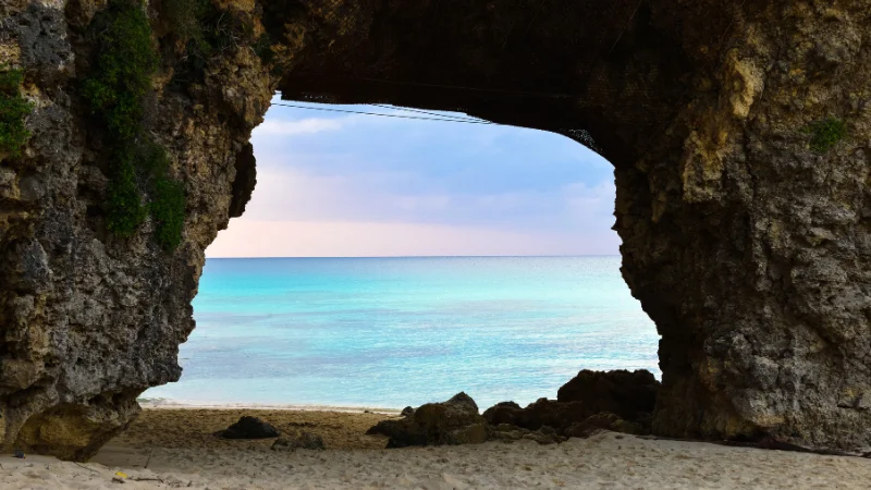 View of the turquoise sea through a seaside cave in Okinawa