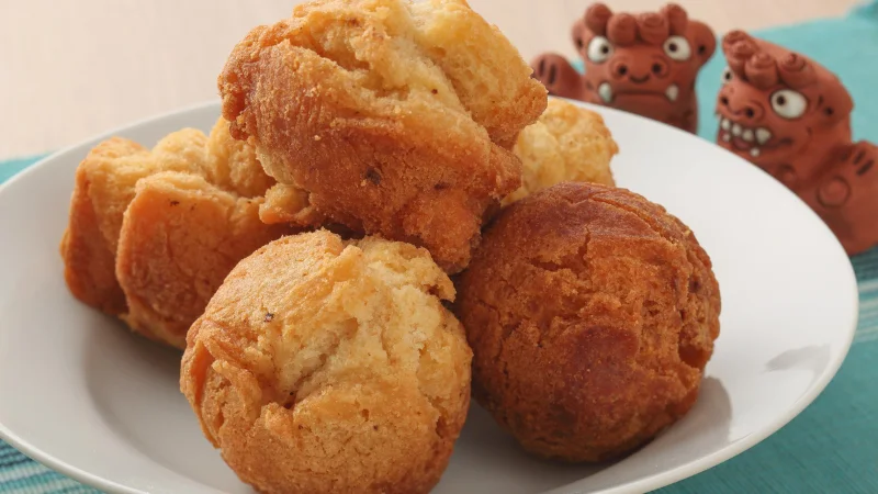 Plate of golden sata andagi, Okinawan sweet doughnuts