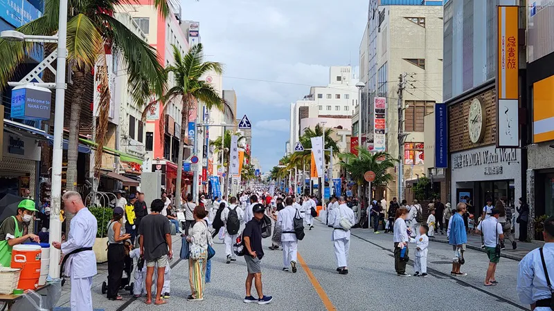 Crowds and karate practitioners gathered on Kokusai Dori for a cultural event in Naha, Okinawa.