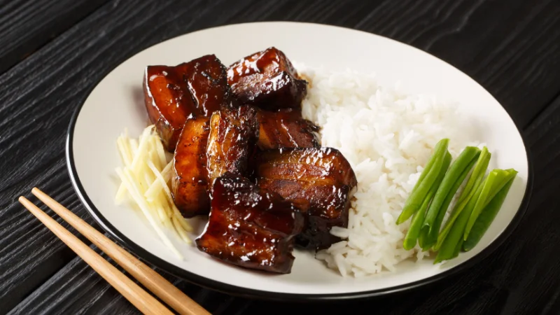 Rafute braised pork served with rice, ginger, and green onions