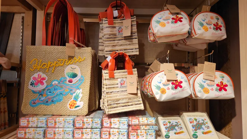 Display of colorful Junglia themed bags and pouches inside the gift shop