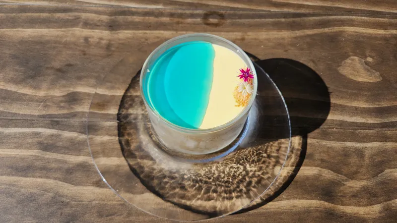 Blue and white tropical inspired dessert in a glass cup at Junglia Okinawa