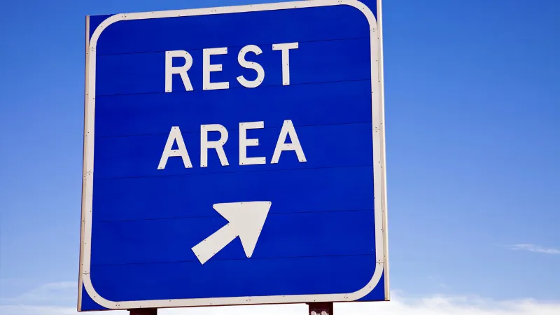 Blue rest area road sign near Yoshinoura Park in Okinawa