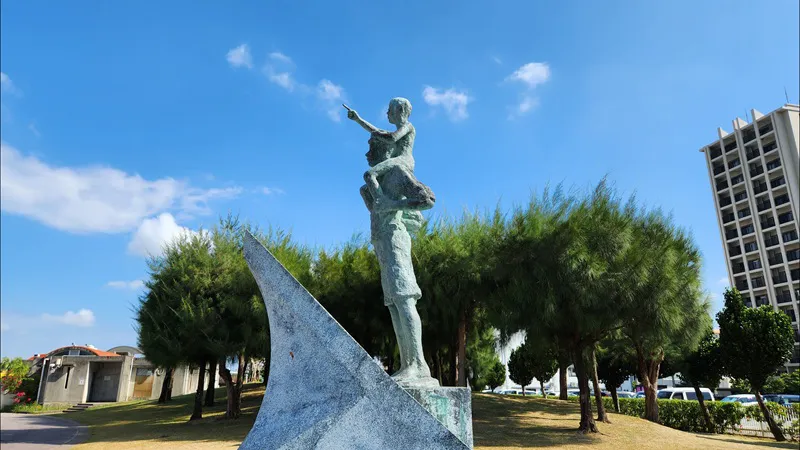 Statue overlooking Sunset Beach near American Village in Chatan Okinawa on a sunny day