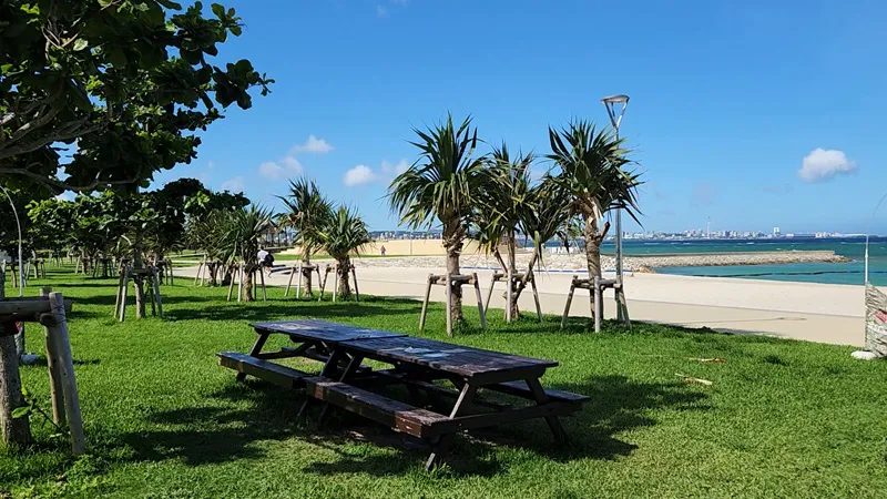 Picnic table on green grass near Sunset Beach in Chatan Okinawa