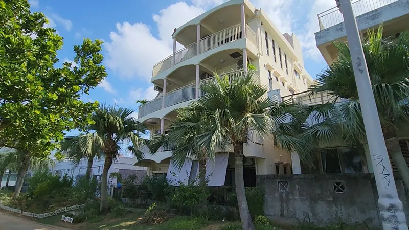 Residential buildings with palm trees near Sunset Beach in Chatan Okinawa