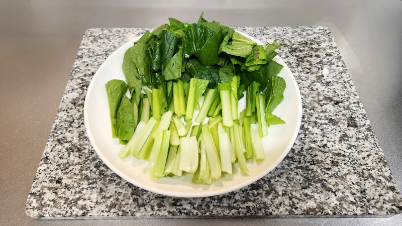 Chopped komatsuna greens prepared on a plate