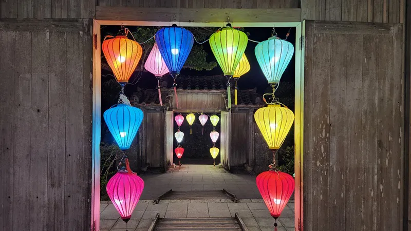 Colorful paper lanterns forming a gateway at Murasaki Mura in Yomitan Okinawa Japan