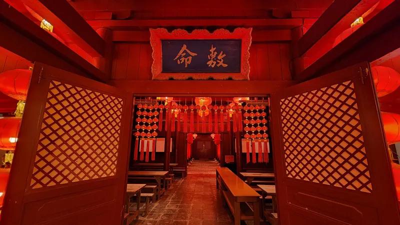 Red illuminated hall decorated with lanterns at night in Okinawa