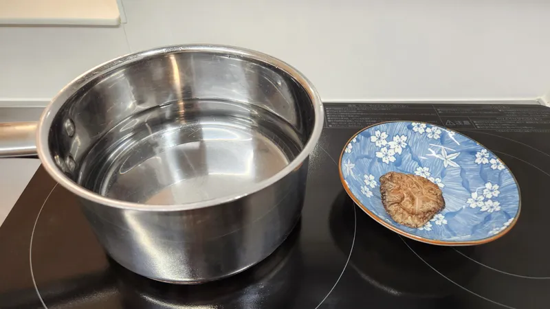 Rehydrated shiitake mushroom removed from dashi broth on a small plate