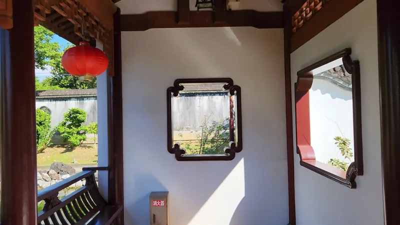 Decorative window opening inside a Chinese style pavilion at chinese Garden Okinawa