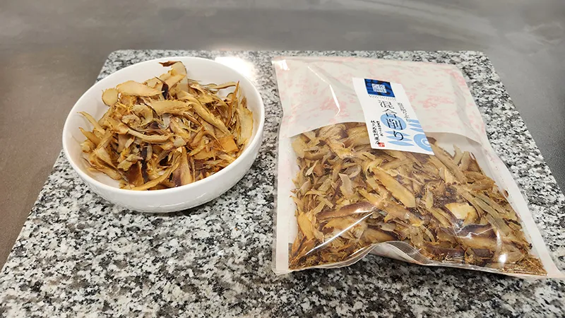 Bowl and package of dried mackerel and sardine flakes for Japanese dashi